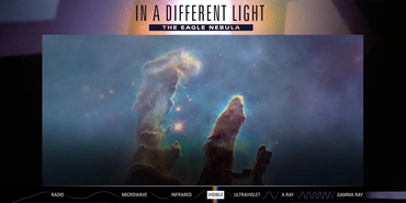 Multicolor image of the Pillars of Creation, with a title above that reads, In a Different Light the Eagle Nebula
