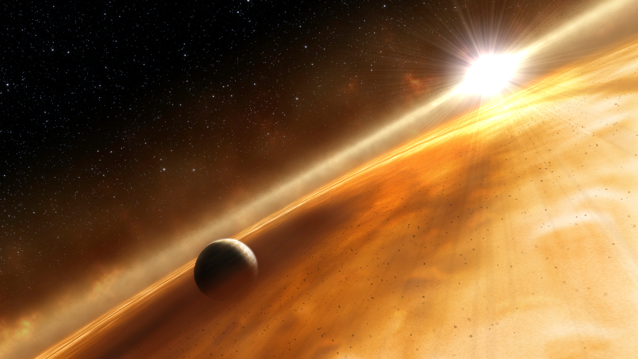 Illustration of an exoplanet orbiting within the dusky disk surrounding its star. The illustration is roughly diagonally split by a line of fluffy gray material, which reaches from the bottom left to the top right. Along the gray material, toward the upper right corner, is the host star represented as a bright white circle. Thin rays of light are emitted from the star. The upper diagonal half shows a patch of the black background of space. Small white points of light are scattered across it. Fluffy dark and light orange material is spread out across the bottom diagonal half. The cloud-like material is darkest surrounding the exoplanet, which is in the lower left, while further away the orange material becomes lighter. Small rocky material is scattered throughout the disk. The exoplanet's surface closest to us is shrouded in darkness. Only its right edge is illuminated by its host star's light. 
